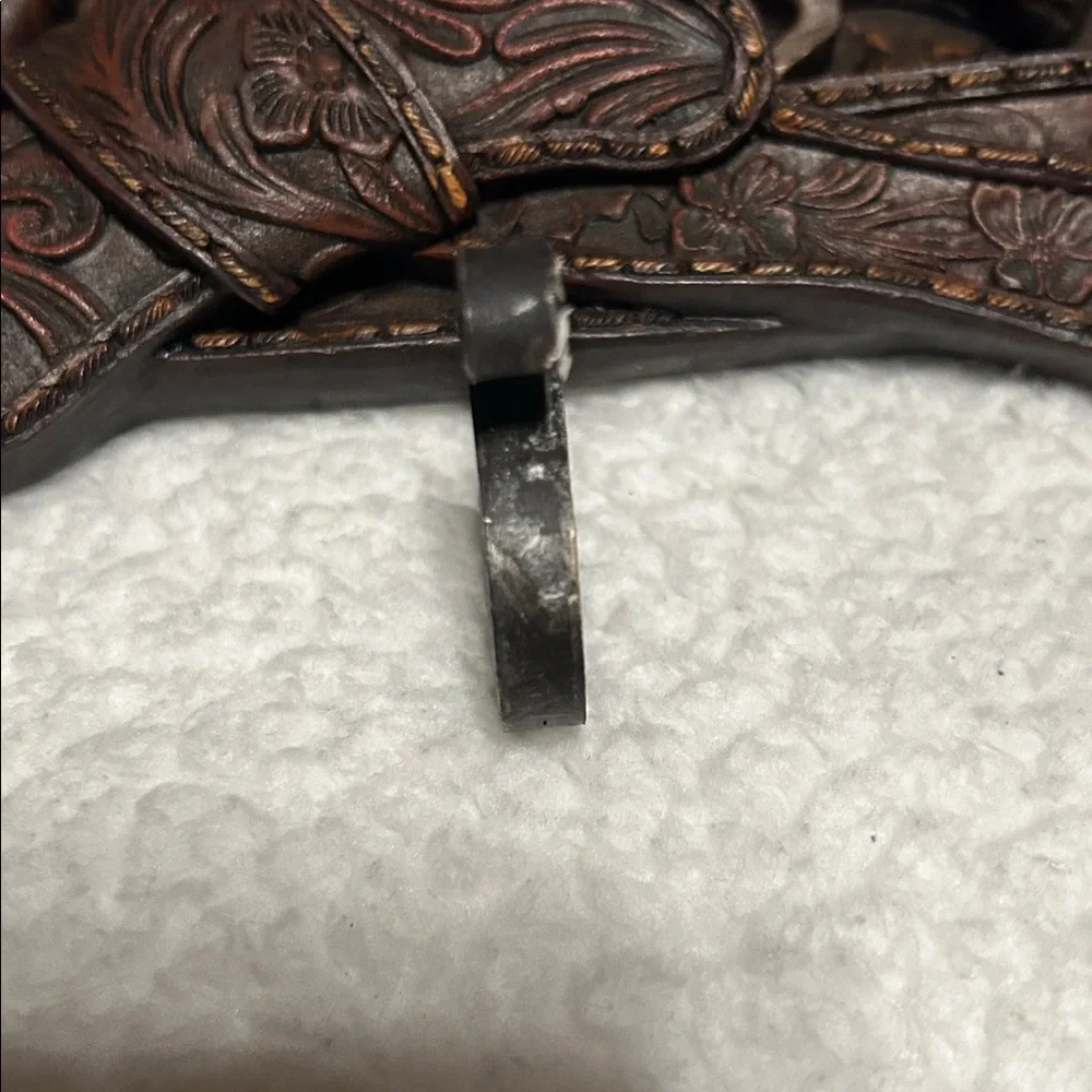 Gun belt wall hanger